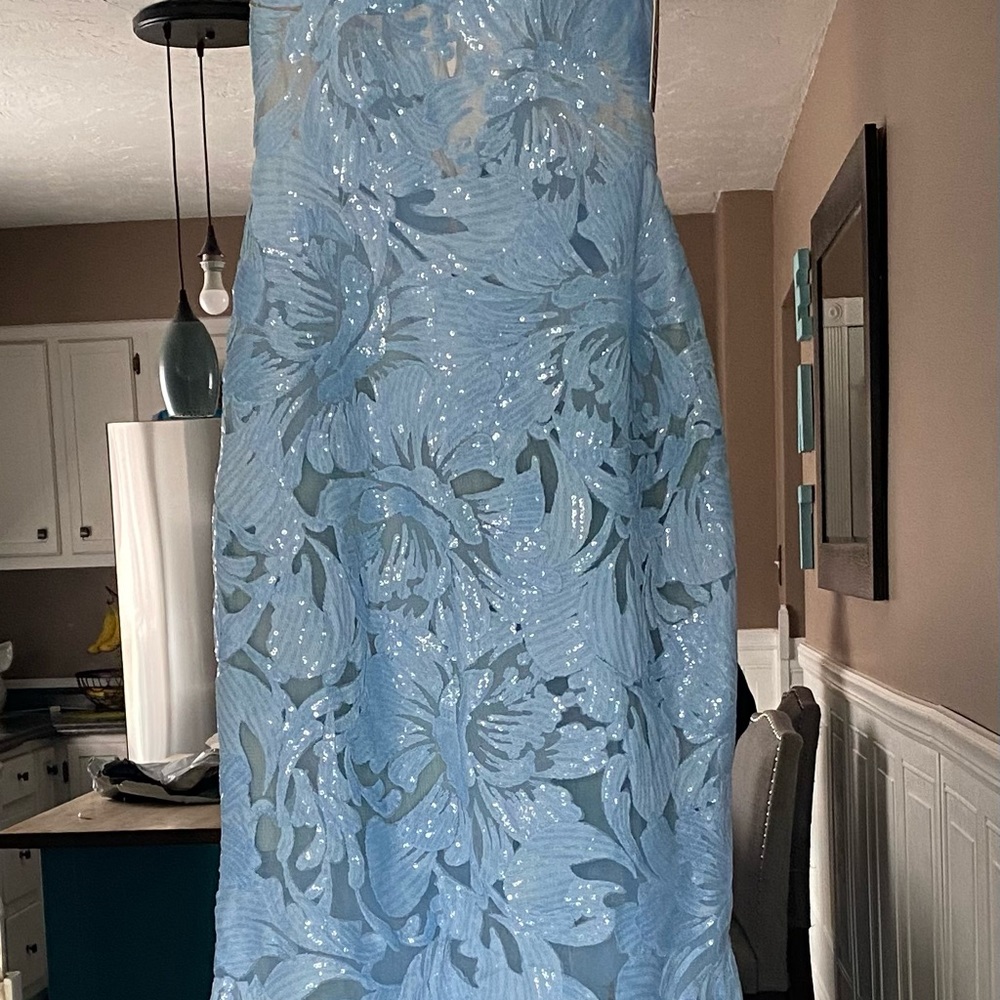 Jovani 60283 prom gown. Beautiful baby blue floral lace with sequins.